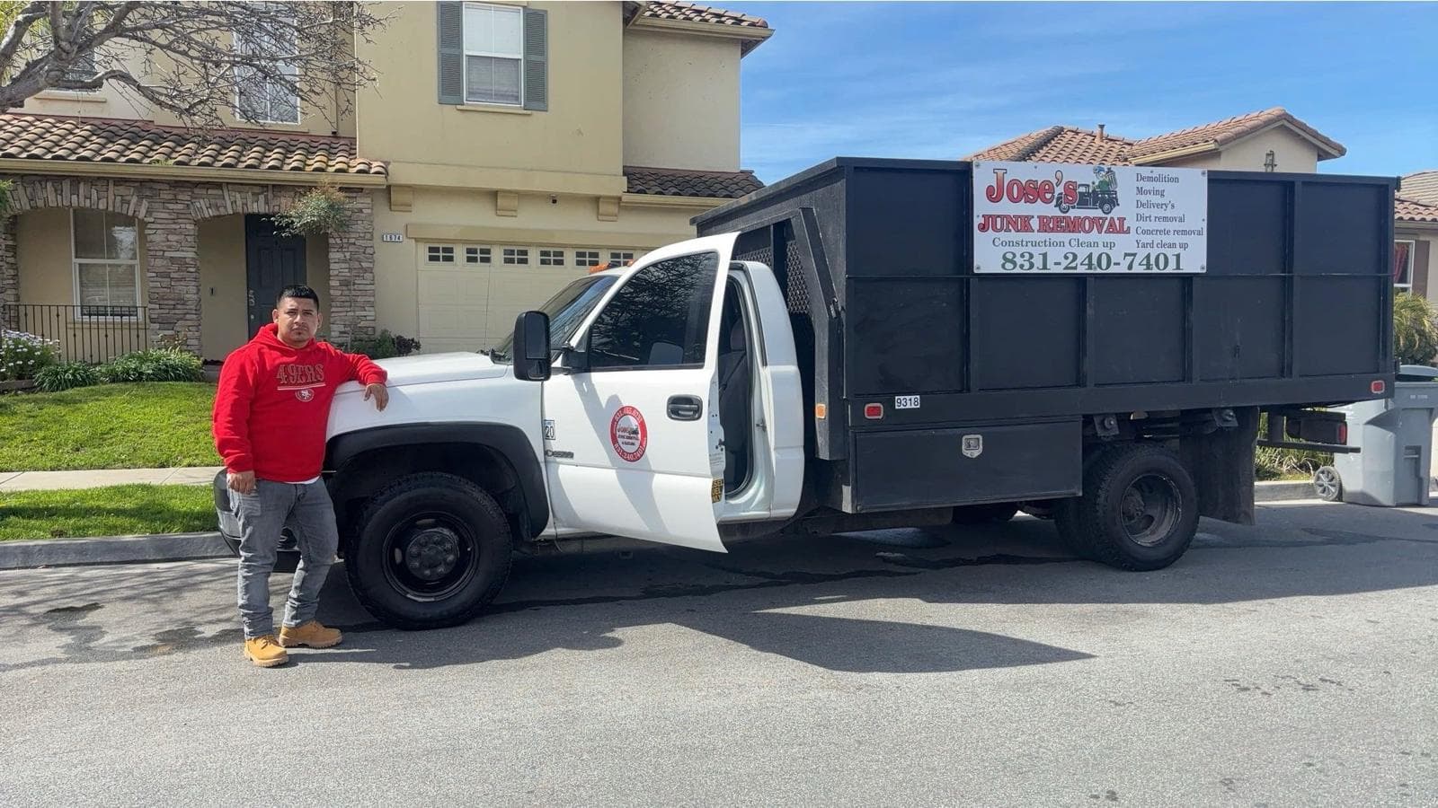 picture of Jose next to his junk removal and hauling truck